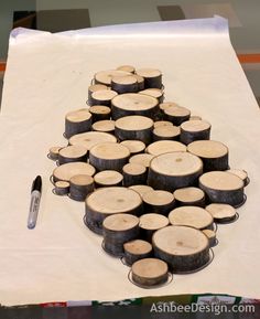 there are many pieces of wood on the table with a pen next to each other