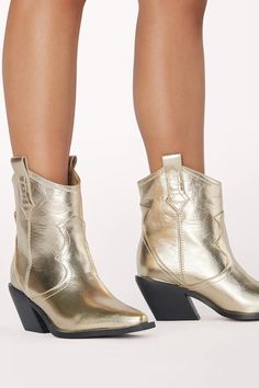 Ulira Boot Shiny gold metallic short cowboy boots. Western-inspired stitching Block heel Pointed toe Pull-on style with pull tabs at sides Synthetic upper and sole Heel Height: 3" Short Cowboy Boots, Metallic Shorts, Corset Crop Top, Frankies Bikinis, Crop Top Sweater, 80 Dress, Heeled Loafers, Blazer Coat, Cowboy Boots