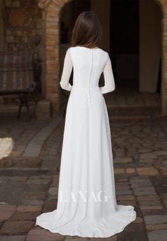 the back of a woman's white wedding dress, with long sleeves and beading