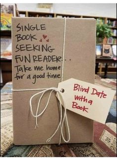 an open book with writing on it and a tag attached to the cover that says, single book seeking fun reader take me home for a good time