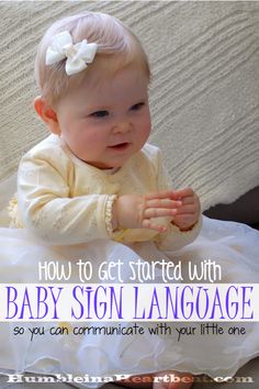 a baby in a white dress sitting on the floor with text overlay that reads how to get started with baby sign language so you can communicate with your little one