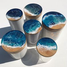 four cups with blue and white designs on them