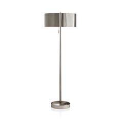 a floor lamp with a metal base and a silver shade on the top of it