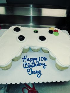 a birthday cake that is shaped like a video game controller