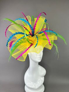 Large crinoline fascinator adorned with color pop feathers. Attaches with headband. Light and easy to wear. Yellow Mini Hats For Races At Royal Ascot, Yellow Mini Hat For Royal Ascot Races, Yellow Fascinator For Royal Ascot, Yellow Fascinator For Royal Ascot Party, Yellow Headpiece For Royal Ascot Races, Yellow Hat Headpieces For Kentucky Derby, Yellow Headpieces For Royal Ascot Races, Yellow Fascinator For Kentucky Derby Party, Multicolor Feather Fascinator For Kentucky Derby