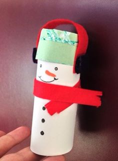 a paper tube with a snowman on it