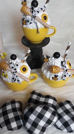 the yellow dishes are decorated with black and white decorations