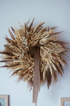 a dried wreath hanging on the wall