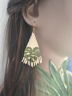 🌷☀️These hand beaded Monstera Leaf Earrings were made with colorful seed beads, all added individually. Each earring was stiffened to prevent folding.  Perfect for the summer or on vacation! ☀️🌸 Note: These hang to 3.5 inches. If you have a short neck like myself, these arent for you.  LOCAL PICK UP NOTE: THIS IS AVAILABLE FOR LOCAL PICK UP!  JUST SEND US A MESSAGE BEFORE YOU BUY IF YOU ARE LOCAL! CUSTOM ORDERS Would you like a custom order? Something similar but in a different size or color? Contact me and we can figure it out together - I love creating custom items so please don't hesitate to ask. Please allow 2-3 weeks from the date you submit payment for your custom order to be created and shipped. We will keep in contact through email so you can see the progress of your custom item. Handmade Beaded Drop Earrings For Vacation, Handmade White Beaded Earrings For Vacation, Handwoven Beaded Earrings For Summer Beach, Handwoven Beaded Earrings For Beach In Summer, Handmade Beaded Earrings With Round Beads For Beach, Handmade Round Beads Beaded Earrings For Beach, Handmade Green Beaded Earrings For Vacation, Adjustable Beaded Earrings For Vacation, Tiny Beads Drop Earrings For Beach