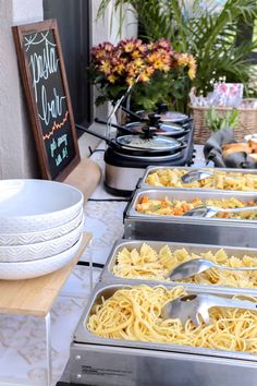 a buffet table filled with lots of different types of food