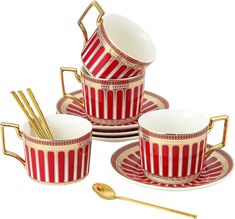 four red and white striped cups with gold trimmings, one cup is on the plate