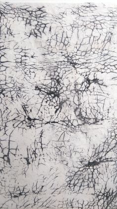 an abstract painting with black and white lines on it's surface, in the middle of