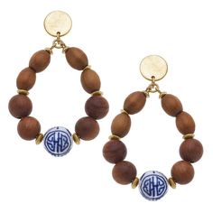 With Blue and white chinoiserie beads, rich woods and golden accents, what's not to love about our Grandmillenial jewelry collection? Perfect to pair with your favorite Quinn resin bracelet or wear each piece on it's own! Each item in the collection is made from natural and painted wood beads, gold hardware and painted porcelain beads. Each necklace comes with a 2" extender. Wooden disc necklace is approx. 24" long while the other styles are approx. 21" long. Bracelets measure approx. 2.5" in di Wood Teardrop Earrings, Painted Wood Beads, Blue Chinoiserie, Resort Chic, Blue And White Chinoiserie, Porcelain Beads, Wooden Bead Necklaces, Resin Bracelet, Chinoiserie Chic