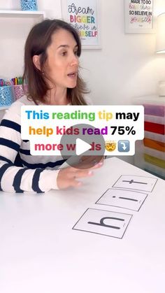 a woman sitting at a table with a sign that reads help kids read 75 % more w / s