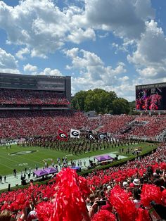 a football stadium filled with fans and cheerleaders