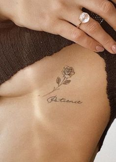 a woman with a rose tattoo on her chest