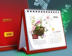 a calendar with a bird's nest on it next to a red and green cover