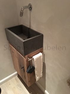 a bathroom with a sink and towel rack