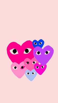 five hearts with eyes on a pink background