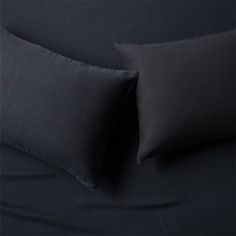 two black pillows sitting next to each other