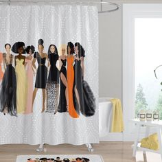 a group of women standing in front of a white shower curtain with black and orange dresses on it