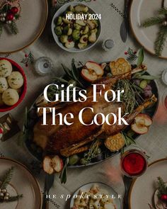 a table topped with plates and bowls filled with food next to christmas decorations on the table