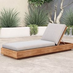 an outdoor chaise lounge with grey cushions