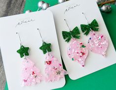 Pale Pink Confetti Christmas Tree or Ornament Earrings These pink theme confetti earrings are perfect for the holiday season! Please choose either the droopy tree or the ornament design in the drop down menu.  Please see the photos for the drop length of each style. *Every earring is unique and the exact confetti look will vary from earring to earring as they are cut from one big sheet of acrylic.* Christmas Party Drop Earrings, Handmade Pink Jewelry For Christmas, Cute Christmas Party Jewelry, Green Earrings For Valentine's Day Party, Green Glitter Earrings As A Gift, Green Earrings For Holiday Parties, Pink Christmas Party Jewelry, Pink Earrings Christmas Gift, Pink Earrings As Christmas Gift