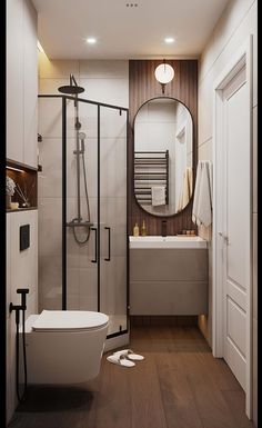 a bathroom with wood flooring and white walls