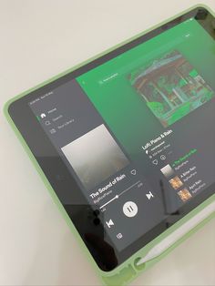 an image of a tablet with music playing on the screen