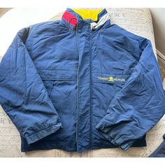 Brand: Tommy Hilfiger Color: Blue Size: Men's Xl Condition: Gently Used - Good Please Note: Color May Vary Slightly Due To Screen And Lighting. All Items, Unless Marked Nwt, Are Gently Used And May Have Signs Of Wear. Vintage Items Are 20-40 Years Old!!! We Try To Call Out Any Flaws/Imperfections In The Description. Please View All Photos For Condition And Feel Free To Message Me For More Pictures Or Measurements. Please Wash All Items Prior To Wear. Want This Piece For A Lower Price? Then, Shop Blue Tommy Hilfiger Outerwear With Pockets, Tommy Hilfiger Blue Outerwear For Fall, Sporty Blue Tommy Hilfiger Outerwear, Casual Blue Tommy Hilfiger Outerwear, Tommy Hilfiger Winter Windbreaker With Pockets, Tommy Hilfiger Puffer Jacket, Tommy Hilfiger Jackets, Vintage Tommy Hilfiger, 40 Years