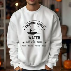 Our 'Thinking About Water' design on a sweatshirt is a great gift for the fisherman in your life. Comfortable and stylish, it's a must-have addition to any wardrobe. Due to monitor and lighting differences, all colors may vary slightly from what appears o   nline ABOUT -Unisex heavy blend crewneck sweatshirt is pure comfort. -Made from polyester and cotton. This combination helps designs come out looking fresh and beautiful. The collar is ribbed knit, so it retains its shape even after washing. Fishing Theme, Fishing Humor, Fishing Gifts, Funny Sweatshirts, Fishing Shirts, Crew Neck Sweater, Sweat Shirt, Crew Neck Sweatshirt, Crew Neck