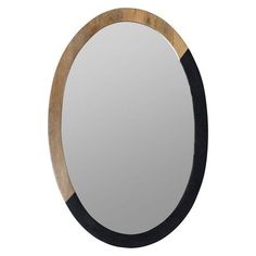 an oval mirror with black trim around the edges and a wooden frame, on a white background