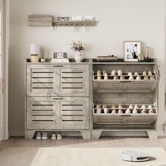 a living room with white walls and wooden shelves filled with shoes on top of them