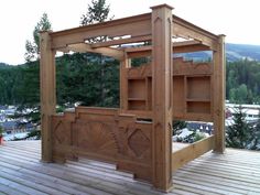 a wooden structure sitting on top of a wooden deck