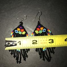 These Beautiful Earrings From Artisan Mxico Are A True Work Of Art. The Colorful Beads And Delicate Fringe Create A Boho Folk Style That Will Make Any Outfit Pop. Handmade In Mexico, These Earrings Showcase The Country's Rich Cultural Heritage. The Earrings Feature A Mix Of Black And Multicolored Beads, Adding A Playful Touch To Any Outfit. The Dangling Fringe Adds Movement And Texture, Making Them Perfect For A Night Out Or A Casual Day. Please See Photographs For A Better Understanding Of The Black Dangling Beads Jewelry For Beach, Beach Jewelry With Black Dangling Beads, Black Beach Jewelry With Dangling Beads, Artisan Black Beaded Drop Earrings, Black Beaded Drop Earrings With Large Beads, Black Large Beaded Drop Earrings, Unique Black Beaded Dangle Earrings, Artisan Black Jewelry For The Beach, Artisan Black Beaded Earrings With Ear Wire