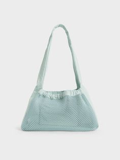 This product is made with at least 20% sustainable materials by weight. CHARLES & KEITH uses recycled, degradable, organic, and water-based materials in our eco-conscious collection.If you are looking for a bag to accompany you on days by the beach and poolside parties, this Terra shoulder bag is it. In lovely sage green, it will add a striking touch of colour to any summer outfit. Lightweight and functional, it will hold everything you want it to with ease. A bonus feature is the removable pouc Casual Travel Shoulder Bag Made Of Recycled Materials, Reusable Nylon Bags For Everyday Use, Everyday Reusable Nylon Bags, Lightweight Nylon Shoulder Bag For Everyday Use, Recyclable Nylon Bags For Daily Use, Everyday Functional Reusable Bags, Summer Nylon Shoulder Bag For Everyday Use, Everyday Nylon Shoulder Bag For Summer, Versatile Bags For Daily Use Made Of Recycled Polyester