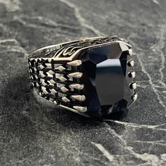 Silver Square Black Onyx Gemstone Ring , Men Natural Dark Black Stone Ring , Handmade Knit Patterned Ring , 925K Sterling Silver , Gift For Him , Same Day For Shipping ✧ Product Details * Handmade İtem * Gender : Male / Female * Material : 925K Sterling Silver * Ring Weight : 10.5 Grams * Gemstone Type : Black Onyx ✔ Usage Details * Silver jewelry is very sensitive to chemicals. It is recommended to keep away from chemical substances such as cream, bleach, deodorant, detergent. * Silver jewelry can also darken quickly in salt water, that is, in sea water. For this reason, it is best to remove them when swimming in the sea. ✔ Shipping * Your orders placed on weekdays are delivered to the cargo on the same day. Your orders placed on the weekend are delivered to the cargo on Monday. ✔ Other D Elegant Black Sterling Silver Skull Ring, Elegant Black Skull Ring In Sterling Silver, Handmade Black Skull Ring As Gift, Handmade Black Skull Ring For Gift, Handmade Black Sterling Silver Signet Ring, Luxury Black Signet Ring Stamped 925, Luxury Handmade Black Rings, Chemical Substances, Black Stone Ring