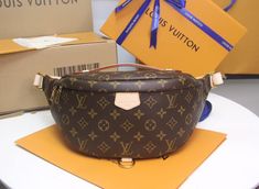 Fashioned in classic Monogram canvas and signed with a “Louis Vuitton Paris” leather patch, this uber-functional Bumbag transforms sportwear into the very definition of casual chic. Wear it as a belt bag, cross-body or over the shoulder for a jauntier look. Detailed Features 37 x 14 x 13 cm (Length x height x width ) Monogramted canvas and natural cowhide leather Cotton canvas lining Natural cowhide leather trim Gold colored metallic pieces 1 main compartment with double zip closure 1 adjustable belt (between 85 cm and 128 cm) 1 zipped back pocket 1 D-ring 1 natural cowhide leather patch Strap: Not removable, adjustable Strap Drop: 85.0 cm Strap Drop Max.: 128.0 cm Handle: Single The reference is either made in France, Spain, Italy or in the US. Bumbag Louis Vuitton, Louis Vuitton Bumbag, Louis Vuitton Paris, Classic Monogram, Handbag Wallet, Wallet Accessories, Adjustable Belt, Leather Patches, Monogram Canvas