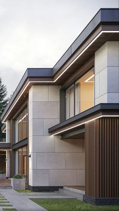 an exterior view of a modern house with large windows and wood trimmings on the side