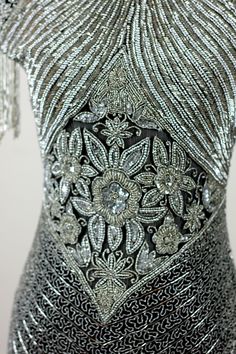 "Timeless Heavily beaded Gown. This gown is absolutely Stunning! This gown is covered with beads crystals, and pearls. You will look like an icon in this piece. It is in excellent condition Measuring: 55\" long Bust: 34\" Waist: 26\" Hip: 34\" Pet Free/smoke free Outstanding in every way Enjoy!" Silver Embellished Gown For Festive Occasions, Silver Embellished Festive Gown, Elegant Embellished Gown For Celebration, Silver Beaded Gala Dress, Floor-length Embellished Gown For Party, Beaded Party Gown, Embellished Floor-length Gown For Party, Embellished Floor-length Party Gown, Floor-length Sequined Gown For Celebrations