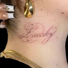 a woman's neck with the word baby written on it