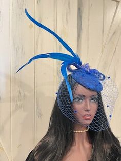 Ready to ship today from TN, USA. I ship quickly and package safely in boxes.  For more unique and one of a kind hat choices, follow this link to my Etsy Shop: https://www.etsy.com/shop/equineelan       This lovely blue fascinator hat has plenty of detail that you may not notice at first glance. The pillbox base is covered in blue lace, the veil is coordinating blue with chenille dots for a vintage look, gracing hat are gorgeous blue tail feathers, and crowning the top is a brooch of gold encrus Blue Tea Party, Jimmy Jones, Hat With Veil, Blue Fascinator, Blue Tail, Bridal Fascinator, Box Hat, Blue Tea, Tea Party Hats