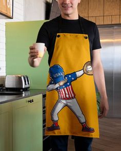 a man in an apron is holding a cup