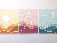 three paintings on the wall with different colors