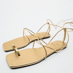 Brand New Never Worn Size 40 Tie Up Flat Sandals Purchased From Zara Gold Strappy Lace-up Sandals, Gold Flat Heel Lace-up Sandals For Party, Gold Lace-up Sandals With Single Toe Strap, Elegant Gold Lace-up Sandals For Summer, Chic Gold Sandals For Summer, Gold Strappy Lace-up Sandals For Vacation, Flat Toe Ring Sandals For Spring Party, Adjustable Gold Toe Ring Sandals For Spring, Gold Open Toe Lace-up Beach Sandals