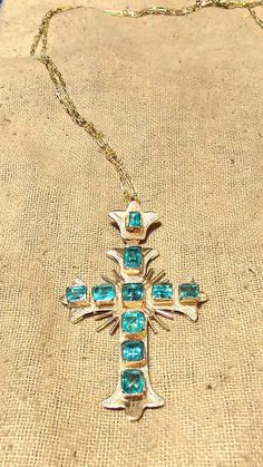 An antique Andes Emerald Cross pendant from a 300+ year old collection. This is the smallest Cross from the Andes Emerald collection. It has been polished and cleaned professionally, and looks like new. AAA Quality genuine Columbian Emeralds laid in 18K Gold. Comes with a solid 14K 24" Anchor Chain. Total carat weight is 1.5 approximately. This is a one-of-a-kind piece that is at least 300 years old right now, but kept in pristine condition. Offers are acceptable, you can email me. Ancient Lore Vintage Hallmarked Emerald Jewelry, Antique Yellow Gold Jewelry With Jewels, Vintage Emerald Jewelry For Collectors, Vintage Emerald Collectible Jewelry, Vintage Emerald Jewelry Collectible, Antique Yellow Gold Cross Pendant Jewelry, Vintage Yellow Gold Cross Pendant Necklace, Antique Cross Pendant Necklace For Formal Occasions, Hallmarked Emerald Jewelry For Collectors