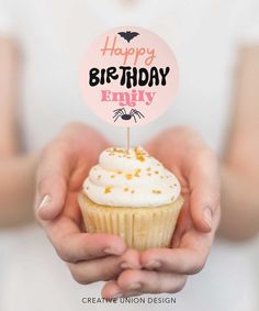 a person holding a cupcake with a happy birthday sign in their hands and the words happy birthday on it