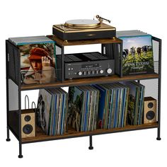 a record player and some records on a shelf