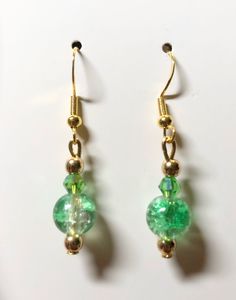 Gold plated findings. green beads. hypoallergenic materials. Lightweight. Green Round Earrings For May Birthstone, Green Earrings For May Birthstone, Hypoallergenic Green Jewelry For Parties, Green Beaded Dangle Teardrop Earrings, Green Teardrop Beaded Earrings For Party, Elegant Green Beaded Drop Earrings, Green Beaded Earrings With Round Beads, Green Teardrop Beaded Earrings With Dangling Beads, Green Teardrop Jewelry With Ear Wire